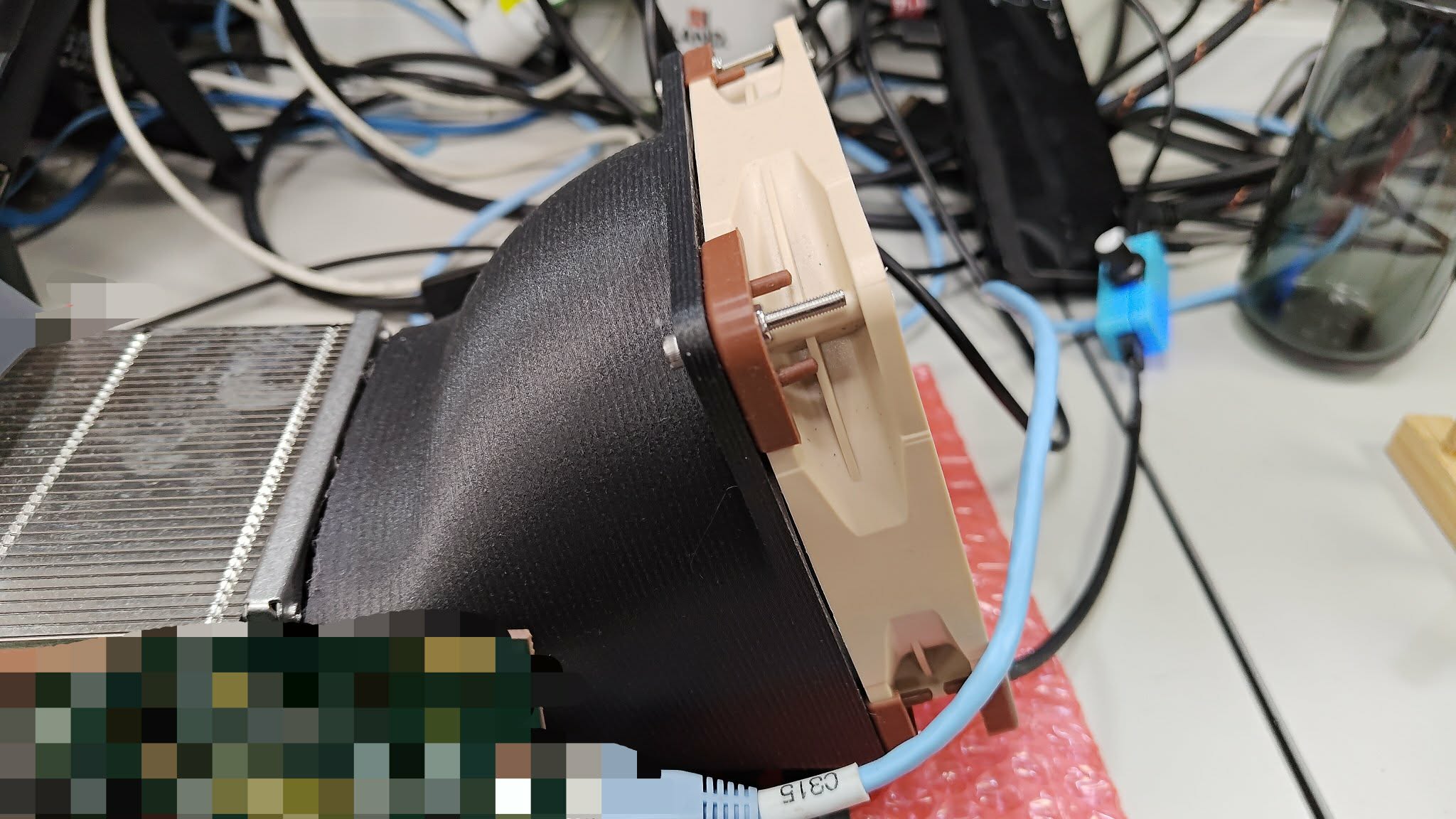 Printed fan duct attached to a development board cooler