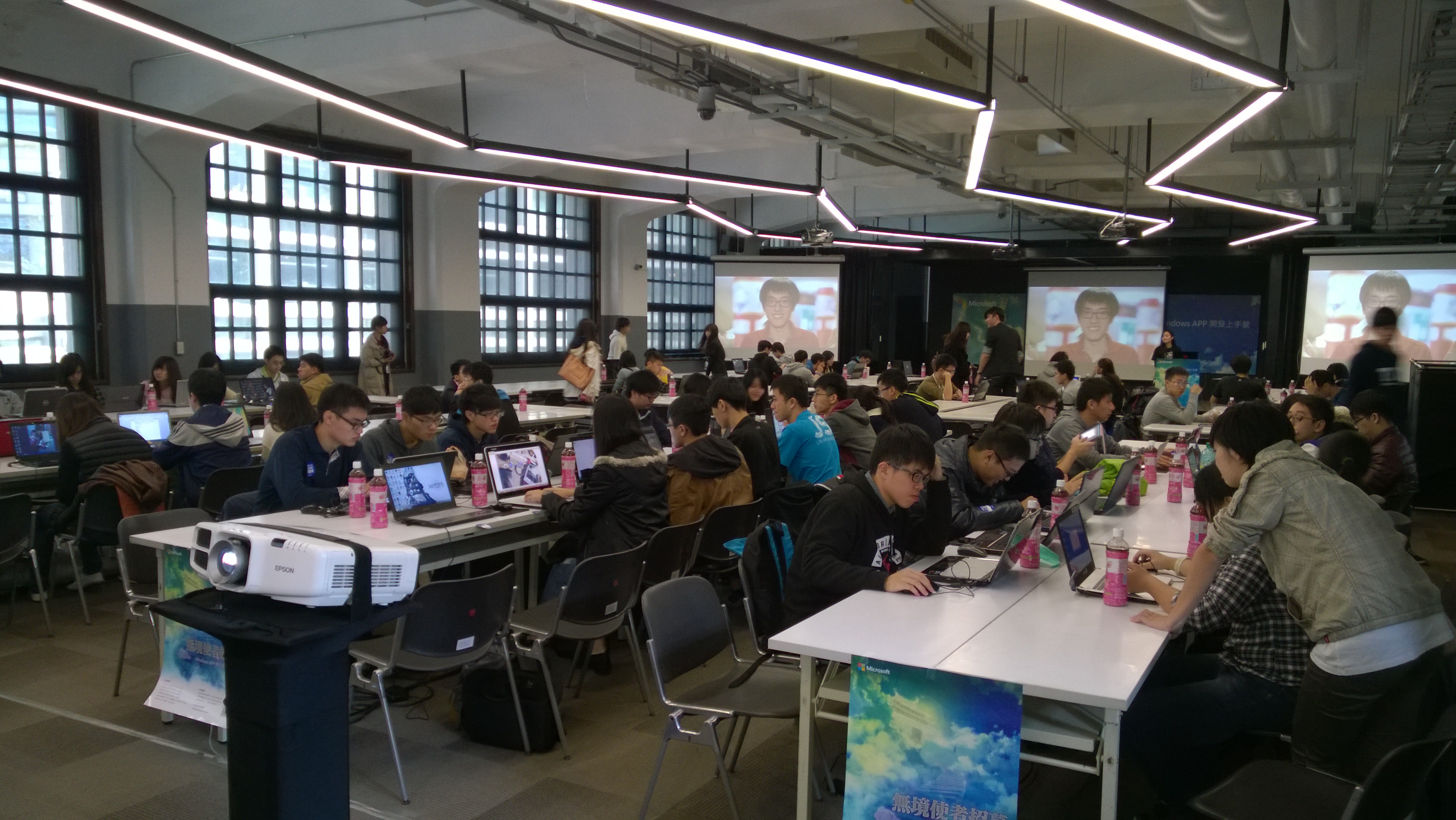 Microsoft developer event with participants working in teams