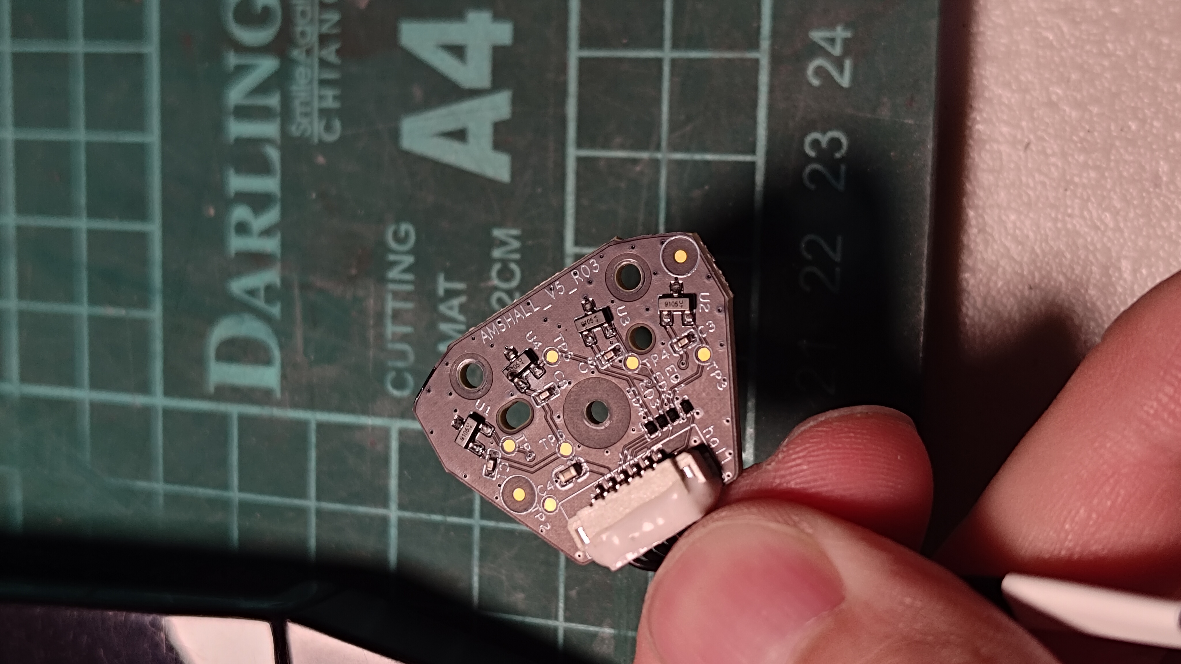 Small PCB inspected during reverse-engineering repair work